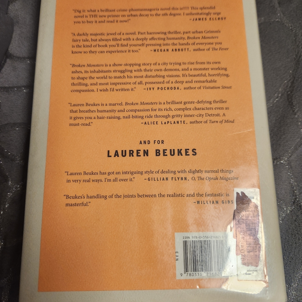 Monsters by Lauren Beukes - Orange and White Hardcover - Picture 2 of 2